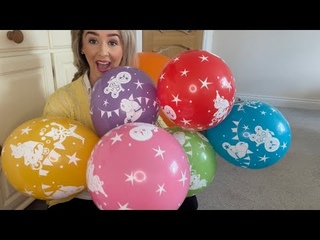 BLOWING UP MULTICOLOURED CIRCUS THEMED BALLOONS